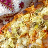 Pizza slice  at Hatool HaYarok - The Green Cat in Tel Aviv