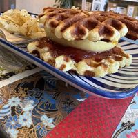 VcGRIDL: vegan Belgian Liege waffles, Just Egg, vegan cheese, tempeh sausage patty, tomato jam, maple syrup    at Torque Coffee in San Diego