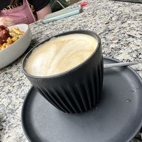 Oat milk flat whitee  at The Village in Maryland