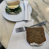 Vegan Earl Grey Lemon Loaf on the right. The dish on the left is a vegetarian egg and kale sandwich.   at Bel Café Downtown in Vancouver