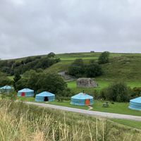Yurts with coloured doors   at Keld Bunkbarn and Yurts in Keld