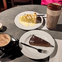 Cappuccino, hot chocolate, chocolate cake, apple cake with vanilla sauce. at Cafe Roasberg (3 Linja) in Helsinki