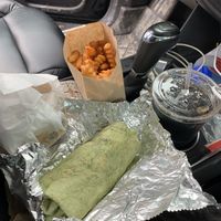 Breakfast burrito and cheese burger with lg fries and a drink (did munch on fries 🤤 they’re seasoned and fantastic!)  at Earth Burger - NW Loop in San Antonio