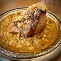 Vegan Samosa Chaat - crispy samosa served over spicy chickpeas with assorted sweet, tangy, and spicy chutneys and crunchy toppings. Ask without the yoghurt to make it vegan.  at Dhol & Soul Indian Bistro in Noord-brabant