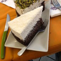 Coconut and pistachio cake at Alhambra Cafe in Milan