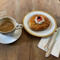 Latte and fruit pastry at Délice de Bernay in New York City