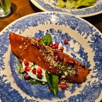 Baked pumpkin with pomegranate seeds (not vegan labneh) at Boulevard Restaurant & Bakery in Samarqand Viloyati
