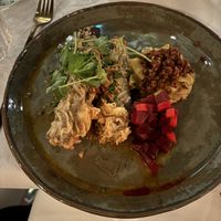 Baked egg plant fried in a crunchy batter with a tasty cabbage side  at Waber. in Overijssel