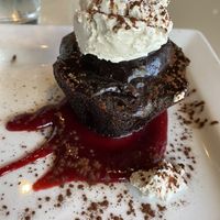 Vegan chocolate cake with raspberry coulis and coconut whip at Bravo in Jackson