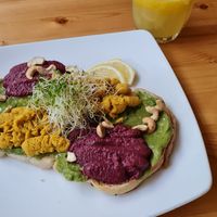 Smashed avocado 2x hummus toast and fresh orange juice at RGB and The Bean Hive in Kuala Lumpur