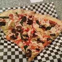 slices of SoHo vegan pizza at Plaza Hotel - Pop Up Pizza in Las Vegas