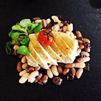 roasted tofu with taggiasche olives, beans and cherry tomatoes  at Gastronomia Le Quattro Stagioni in Adria