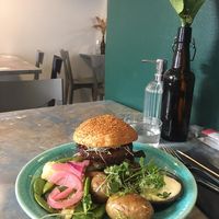 Pulled oats burger with baked potatoes, mayonnaise and vegetables at OmNam in Helsinki