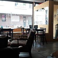 Cute interior featuring two cats at Cafe Schnurrke in Cologne