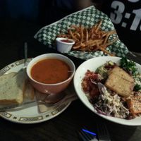Soup of the day (spicy tomato I believe), French fries, and the 'other' bowl. YUM. at bloomer's in Toronto