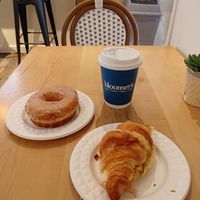 Cheese and tomato croissant and glazed doughnut with a hot chocolate. at bloomer's in Toronto
