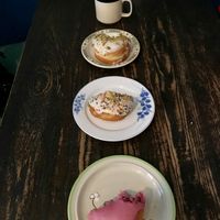Elderberry, birthday cake, and pistachio rose doughnuts- and a cup of coffee :) at bloomer's in Toronto