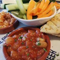 Vegan plate for 8.50. Jackfruit, bread, three different dips including houmous, fresh veggies and bulgur. Delicious! at The Real Greek - Bankside in South East London