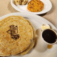 Vegan pancakes, vegan butter, syrup, vegan biscuit, and vegan breakfast sausage at Harold's Diner Soda Fountain & Farmacy in Eureka Springs