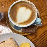 Vegan Autumnul latte, falafel and tomato pannini. Vegan biscuit    at  Big Mugs in England