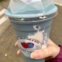 Cloudy sky smoothie (mango, banana, spirulina, oat milk, blue agave) at Berry Much in Seattle