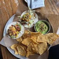 Sweet potato taco, vegan chorizo taco, chips and guac  at La Carnita in Toronto