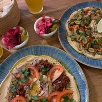 Sun-dried tomato a d chorizo hummus plate at Hummus Amamamusi in Krakow