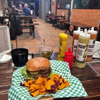 Lentil burger with additional chips and coffee. The menu isn't entirely vegan; you need to specify. (I am not vegan and did not mind that mine had cheese). at Aura Gastro Experiencias in Puebla