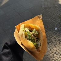 Pita with mushrooms, vegan meat, Sellerie, spinach and pickles + some herbs and sauce.   at Pilz Imbiss in Berlin