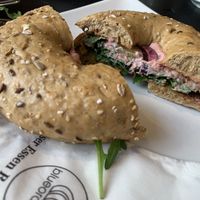 Bagel with rocket salad, red beet hummus, pickles and sweet mustard 💚  at Blueorange Coffee and Bagel - Margaretenstrasse in Vienna