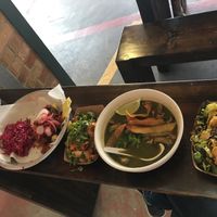 tamale with soy chorizo, patatas (no sour cream), hominy stew, Brussels sprouts at The Bite in Kansas City