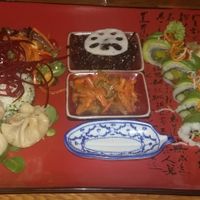xmas bento: miso with tofu (not pictured), black seaweed and lotus salad, Danube salad, vegan futomaki with asparagus and avocado, Mongolian dumplings, Asian tofu wok with veggies! at Helens Sushi in Stockholm