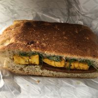 Hot Breakfast Sandwich devoured in my car. Maple sage breakfast sausage, eggy tofu, cream cheese & fig spread.  at The Herbivorous Butcher in Minneapolis