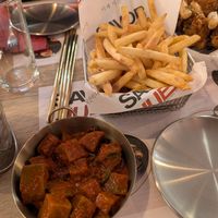 kimchi and fries with plum powder at Savor Hub - Korean Fried Chicken in Comunidad De Madrid