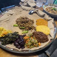Veggie Combo for one with Mushroom Kitfo in the center  at Feru Ethiopian Cuisine in Washington