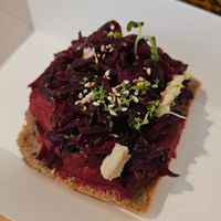 Hummus Beetroot Open Sandwich
Creamy beetroot hummus spread on a slice of our rye bread combined with sesame oil and toasted sesame seeds topped with roasted beetroot. at Nomad Bread & Coffee in Lefkosia
