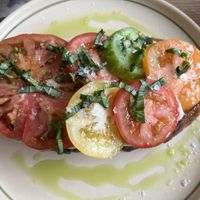 Heritage tomato sourdough with cashew cream & basil oil  at Grounded in Aberdeen