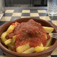 Potatoes with meatballs and tomato sauce  at Vegan Rock in Sevilla
