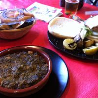 Espinaca con garbanzo (spinach with chickpeas, sooo tasty!) and Burgers.  at Vegan Rock in Sevilla