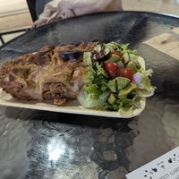 Today's special, lasagna with a side salad at Sacred Garden Plant Based Deli in Rhodes