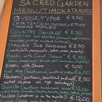 Current menu July 2026 at Sacred Garden Plant Based Deli in Rhodes