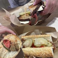 pastrami sandwich with sourdough bread and country sausage  at Sacred Garden Plant Based Deli in Rhodes