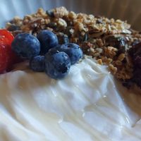 Granola with coconut yoghurt and cherry compote at Nourish Cafe in England