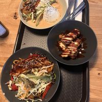 Mock duck in peanut sauce, crispy tofu, and mock chicken with fried udon    at Da Nang Vegan in Essen