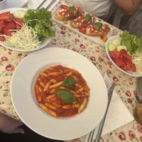Fresh pasta with tomato sauce, mixed summer salad and tomato bruschette with goats cheese  at Aterina in Korcula