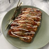 Korean sausage bread   at Canela Vegan Bakery & Cafe in Calgary