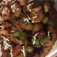 Patacón Gulasch close up at La Cocinita Verde in Bogota