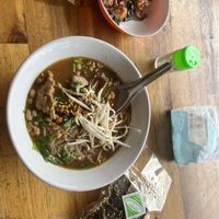 So good! Spicy Tom yum! Plug seaweed snacks and crispy tofu for 60 baht.   at Sangwiroon Vegetarian in Chiang Mai