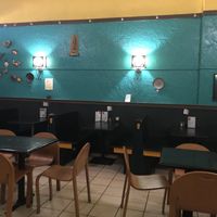 Interior shot of green walls and little tables   at Baja Bean Co in Staunton