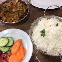 Aloo Gobi Baigan’ (potato, cauliflower and aubergine) curry with steamed rice. at Meat Free Planet in Wolverhampton